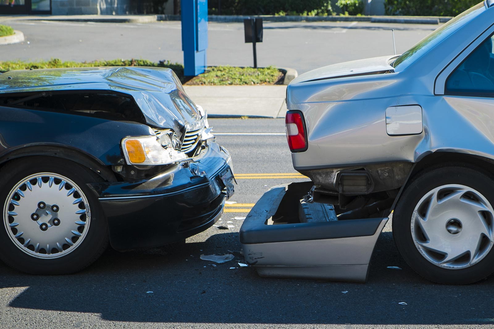 Auto accident involving two cars on a city street